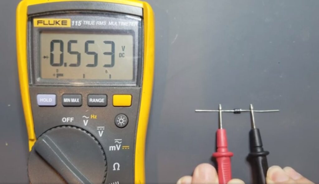 Testing a diode with a multimeter. Forward-biased condition. 